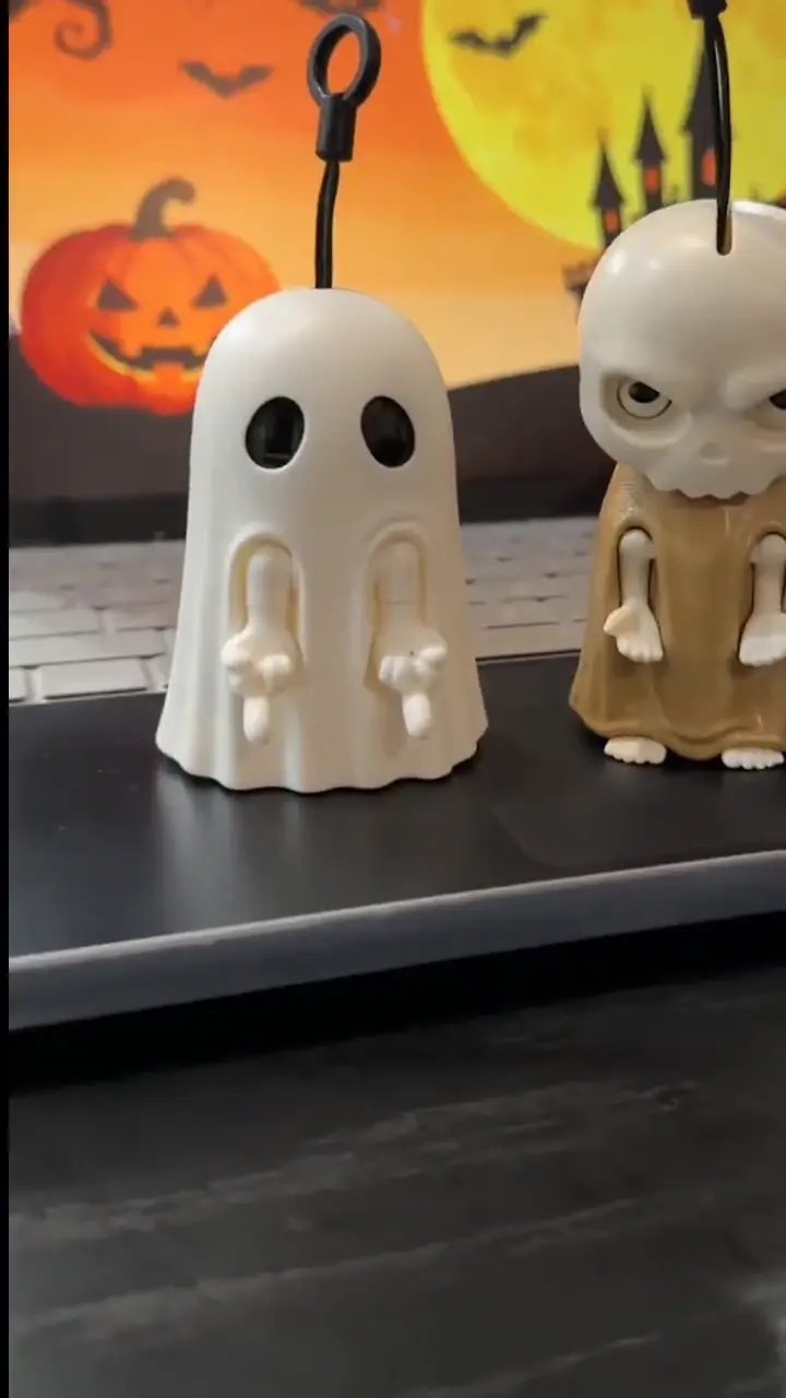 Interactive Halloween ghost and skeleton keychains