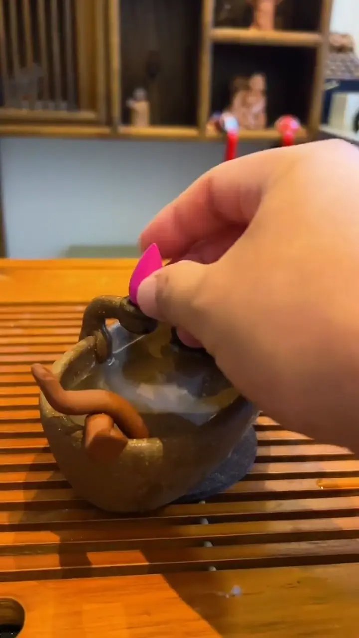 Bathtub backflow incense burner fills with smoke